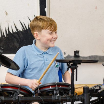 Young student drumming