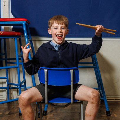 Student with drumsticks