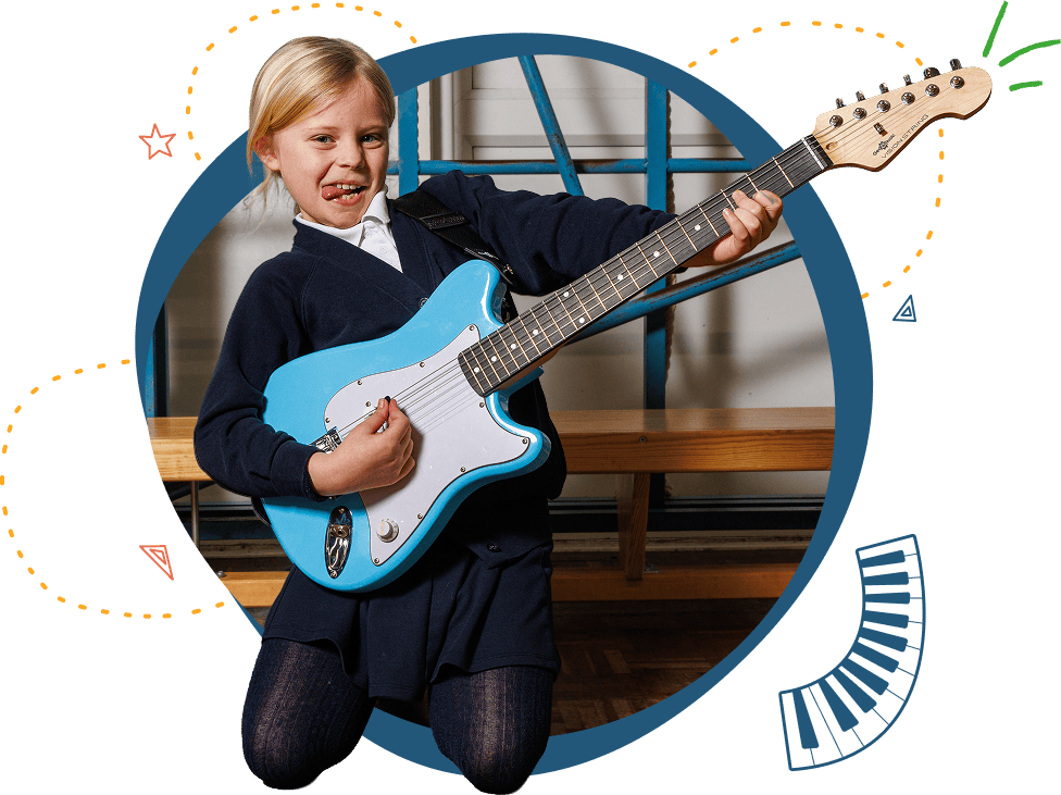 A pupil playing guitar during a Musical Minds lesson